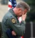 Cordula's Web. USAF. Lt. Col. Kenneth Denman grieves during a candlelight vigil to honor nine Airmen who died in a crash.